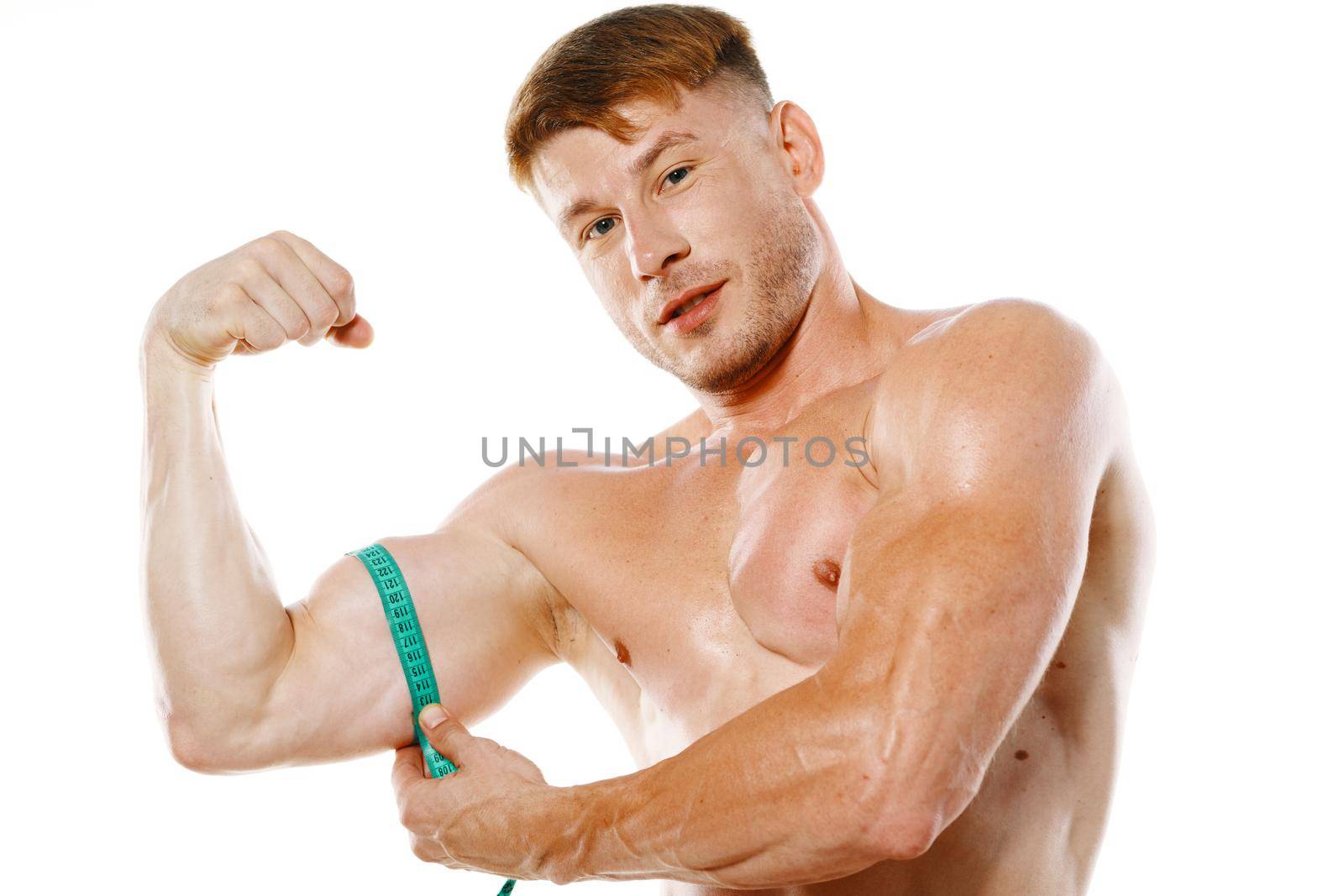 athletic man with measuring tape muscle workout. High quality photo