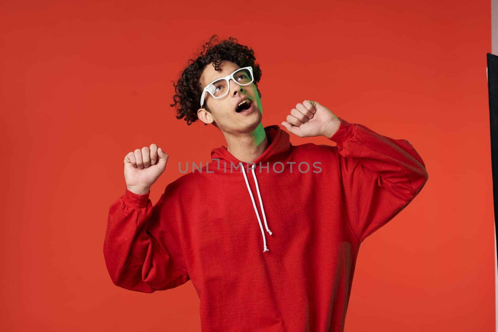 guy in red sweater posing heart holiday isolated background. High quality photo