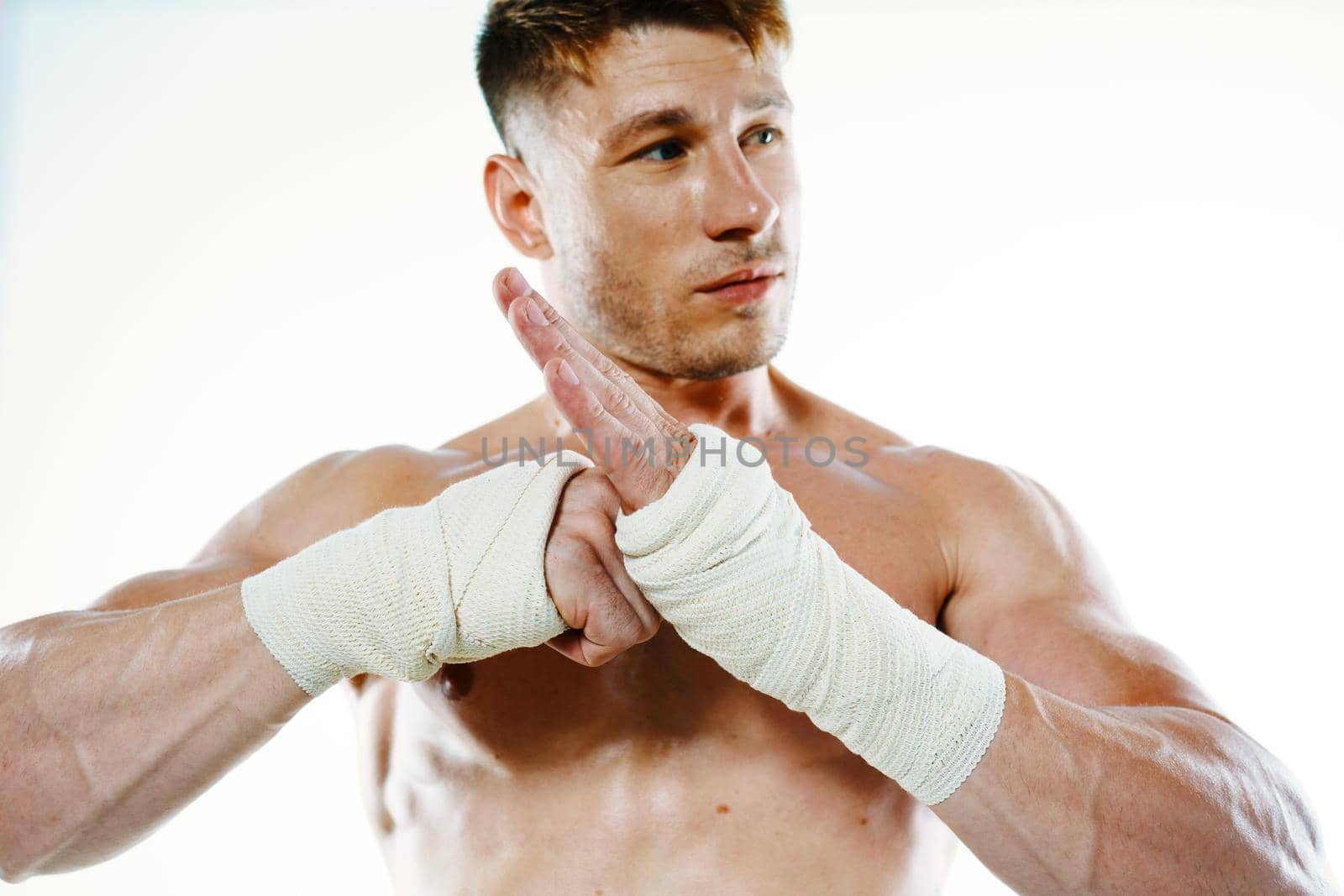 muscular man with bandaged arms gym boxer. High quality photo