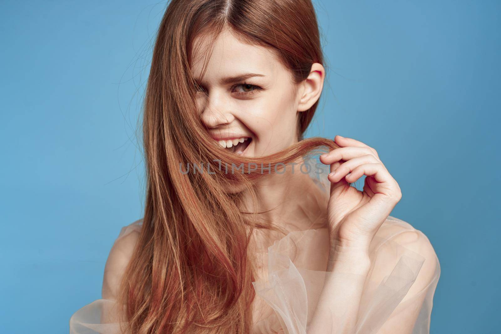 portrait of a woman attractive look lifestyle romance blue background. High quality photo