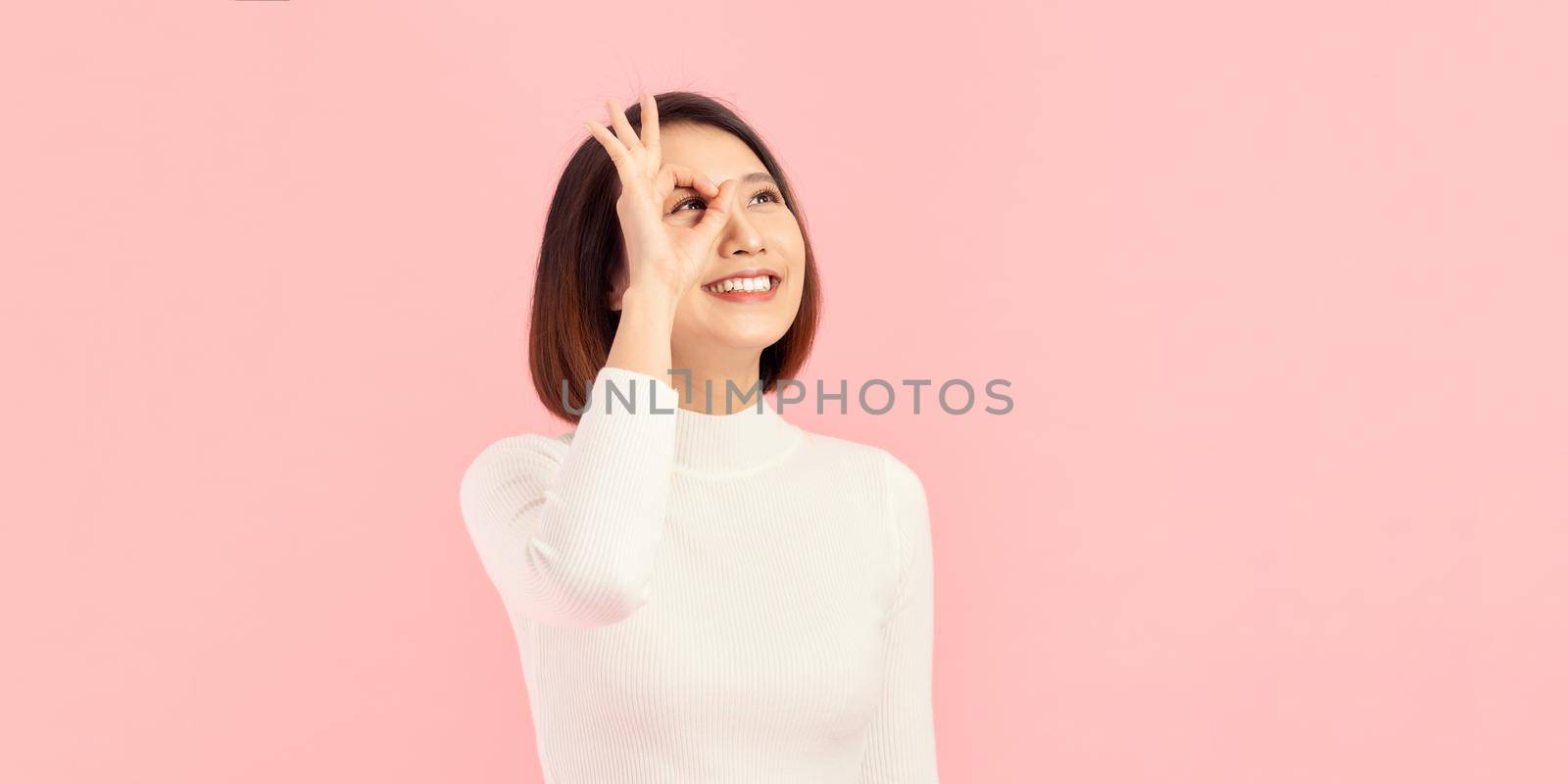Woman with ok sign ok eye by makidotvn