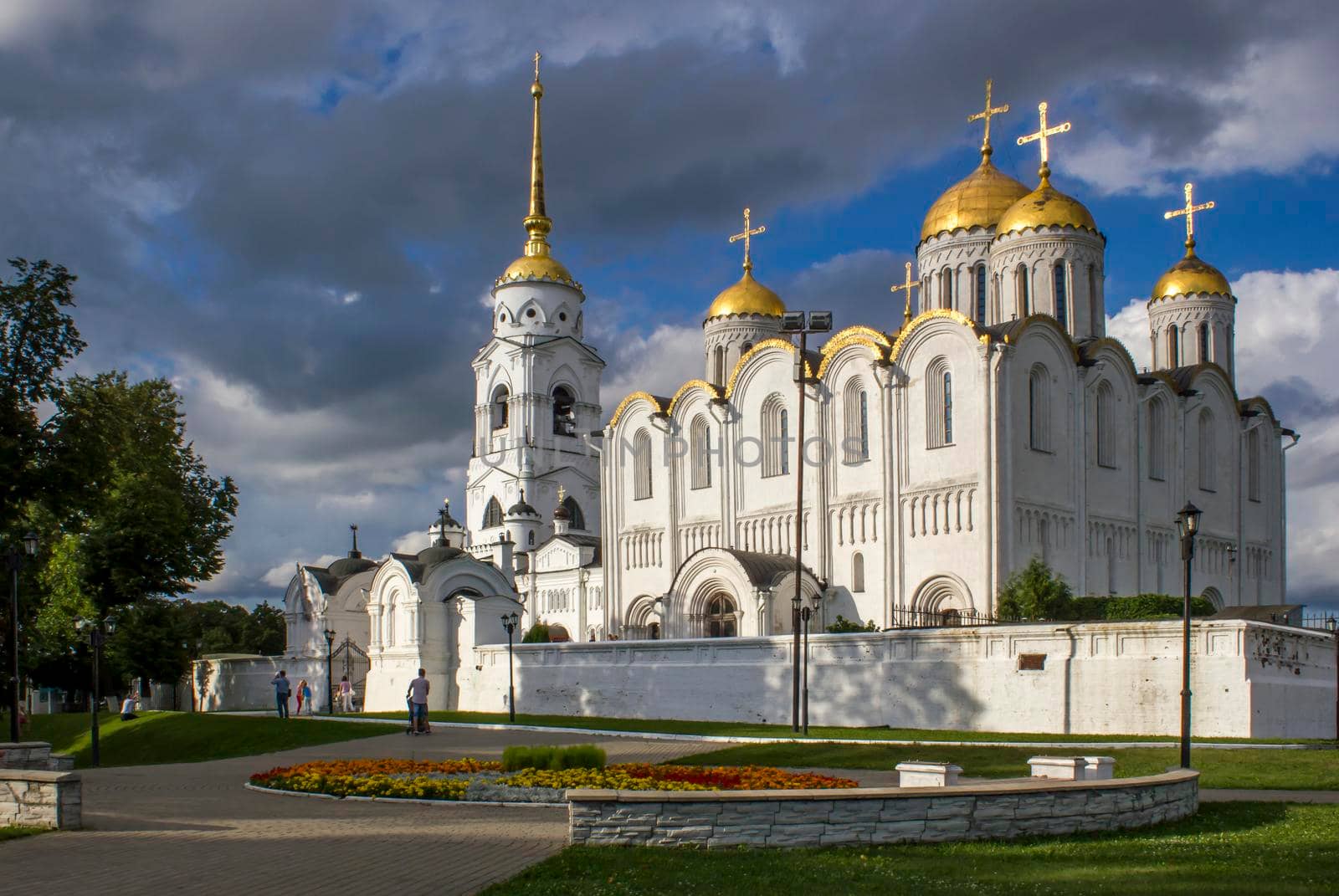 Vladimir, Russia - August 04, 2016: Assumption Cathedral. White orthodox temple with golden domes on the background beautiful sky.