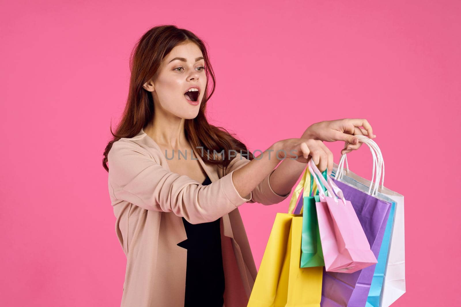 beautiful woman attractive look shopping smile summer style pink background. High quality photo