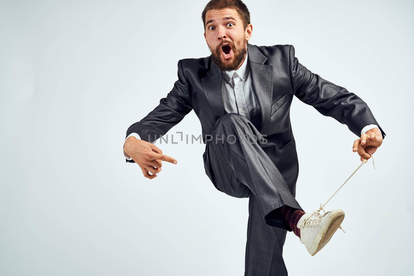 business man in suit motion emotions studio. High quality photo