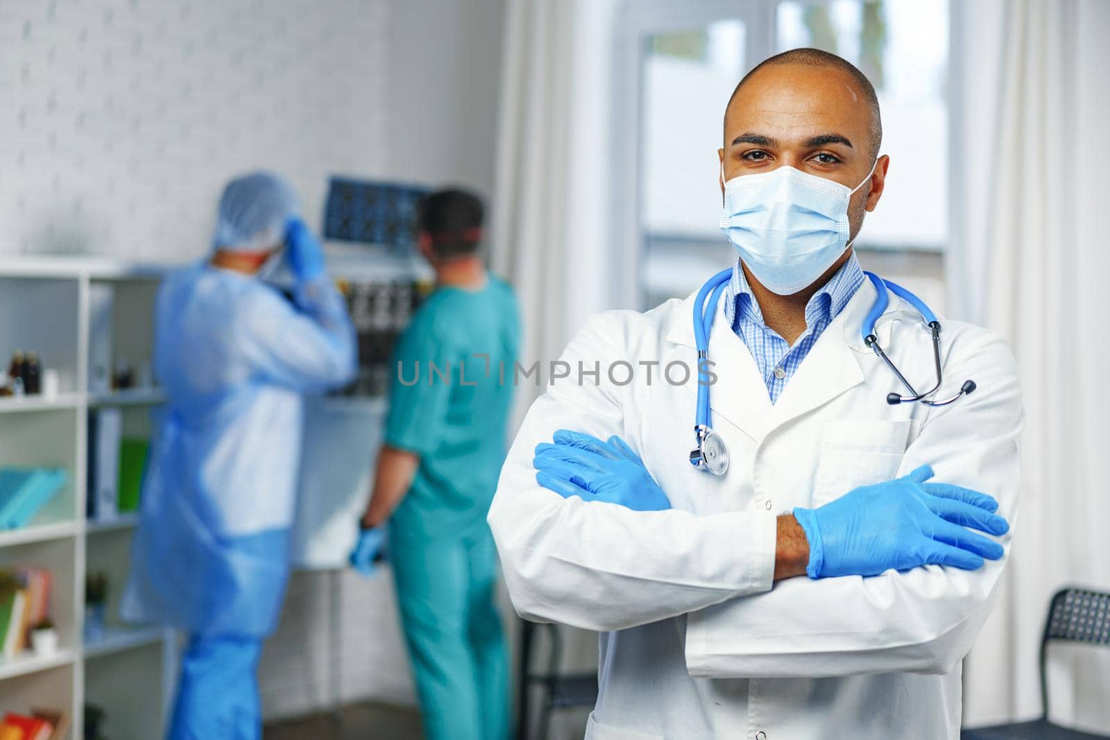 Portrait of african american doctor, hospital cabinet background