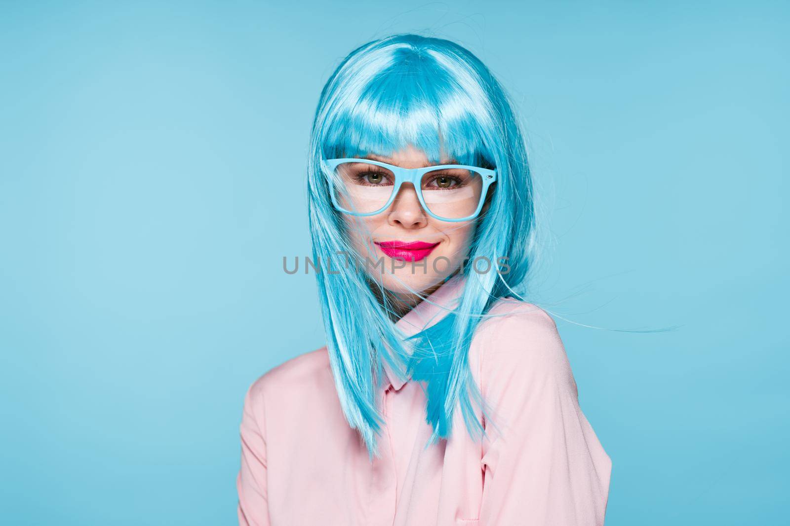 Glamorous woman blue wig makeup fashion posing. High quality photo