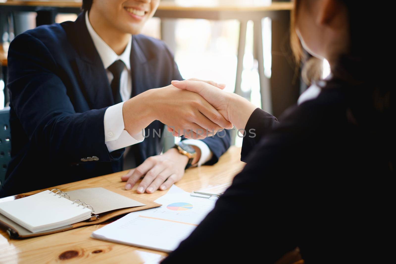 Business people shaking hands with partnership success of business deal. trust partner and work agreement concept. by itchaznong