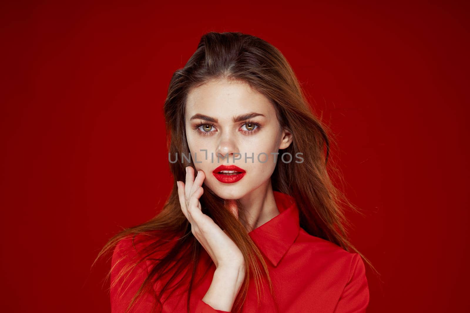 woman in red shirt posing fashion red lips fun. High quality photo