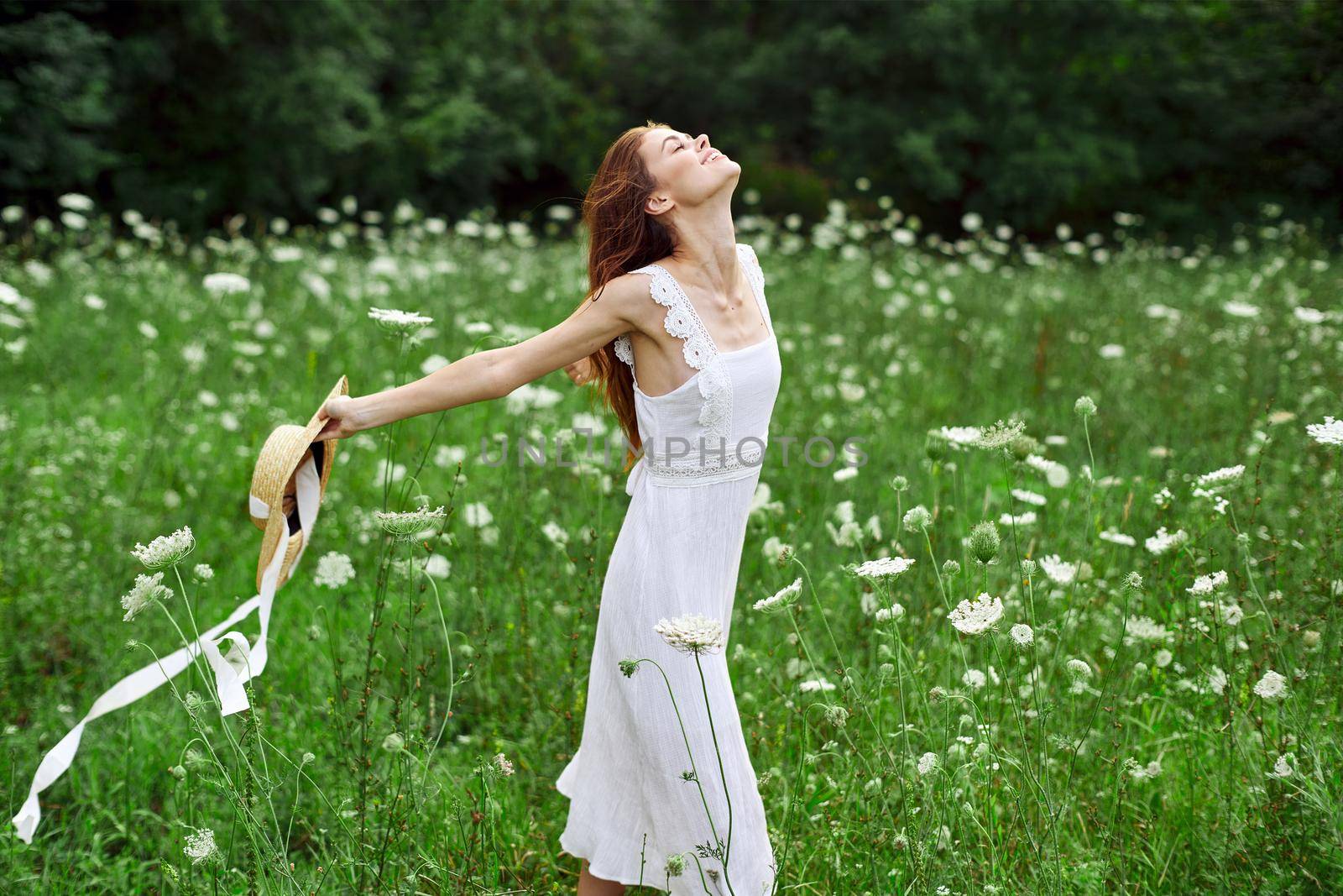 pretty woman walking in the field flowers freedom nature. High quality photo