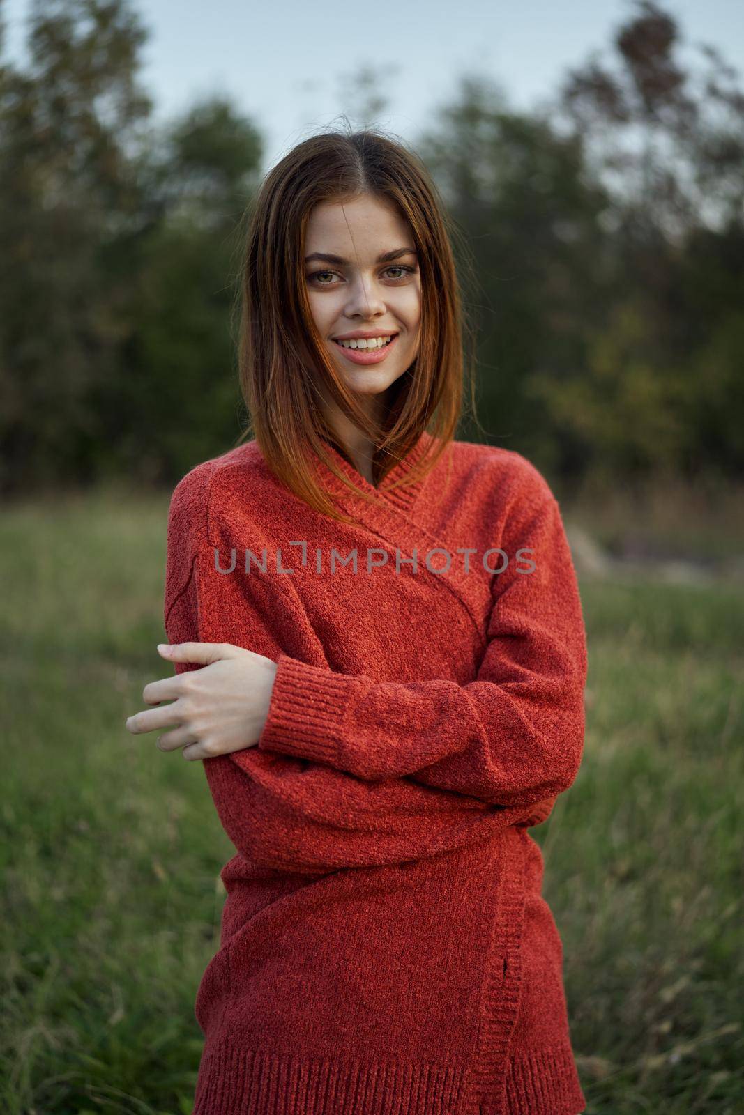 woman red sweater cool air nature romance. High quality photo