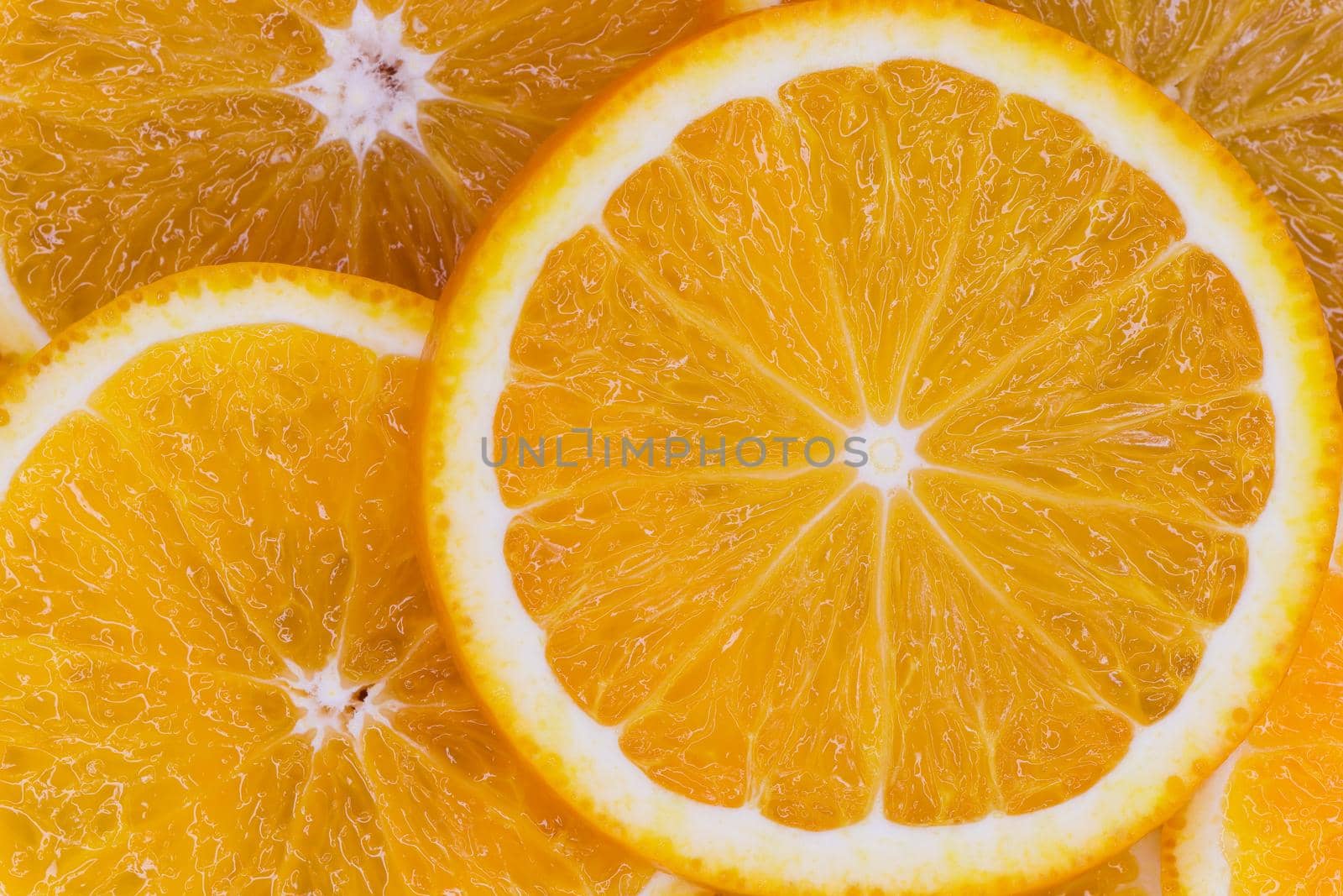 Fresh Valencia orange (Citrus x sinensis) citrus fruit slices flat-lay frame