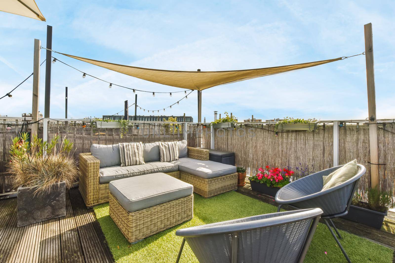 Luxurious and stylish courtyard with a garden umbrella and lots of furniture