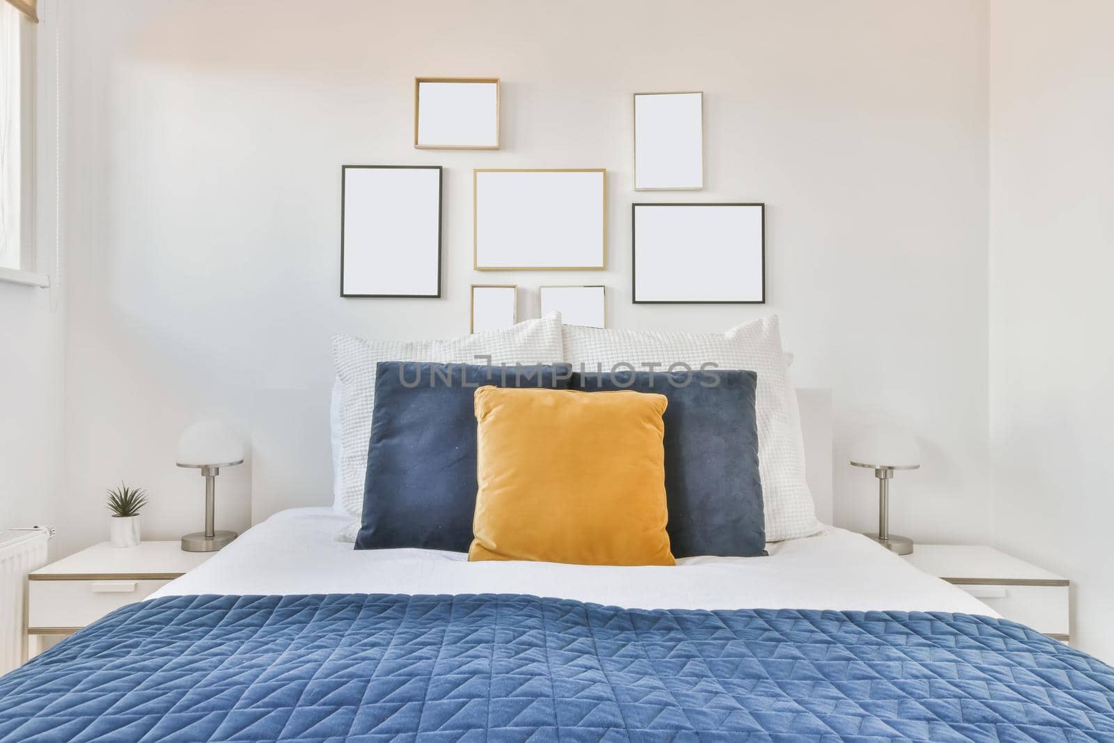 Luxurious bedroom with soft bed and blue bedspread