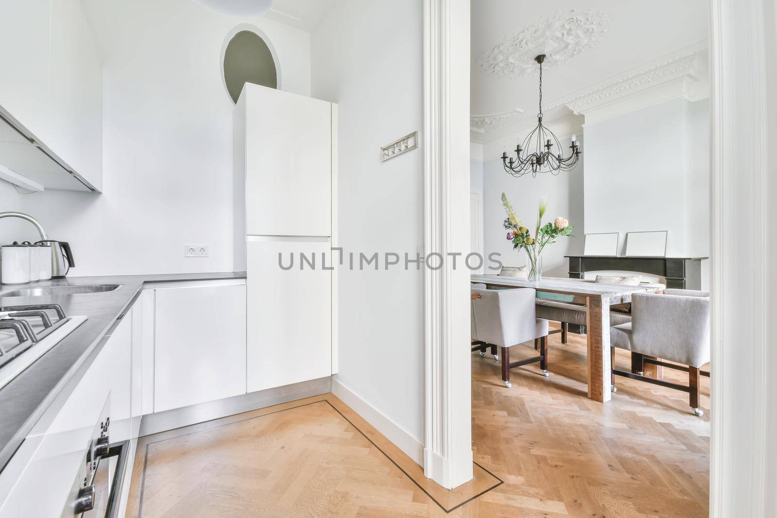 Arch leading from the kitchen to the chic dining room