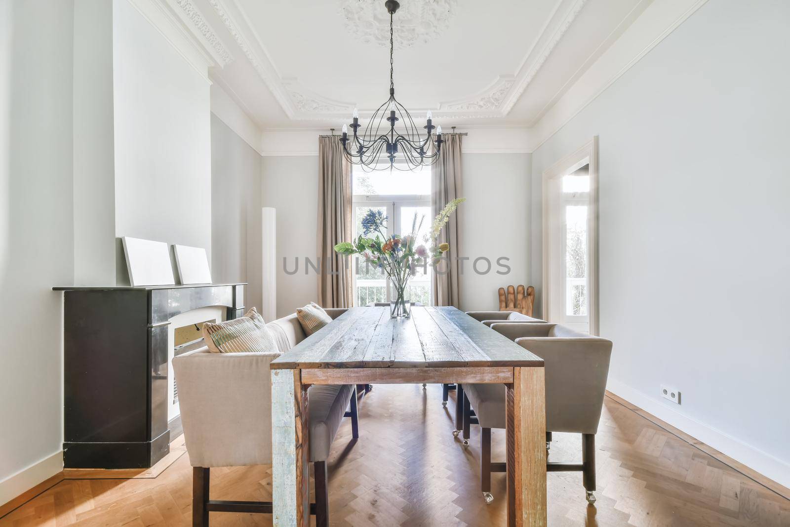 Elegant dining room with large table and comfortable soft chairs
