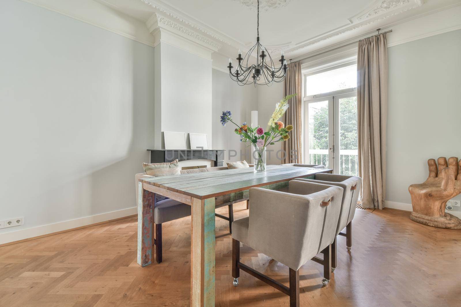 Elegant dining room with large table and comfortable soft chairs