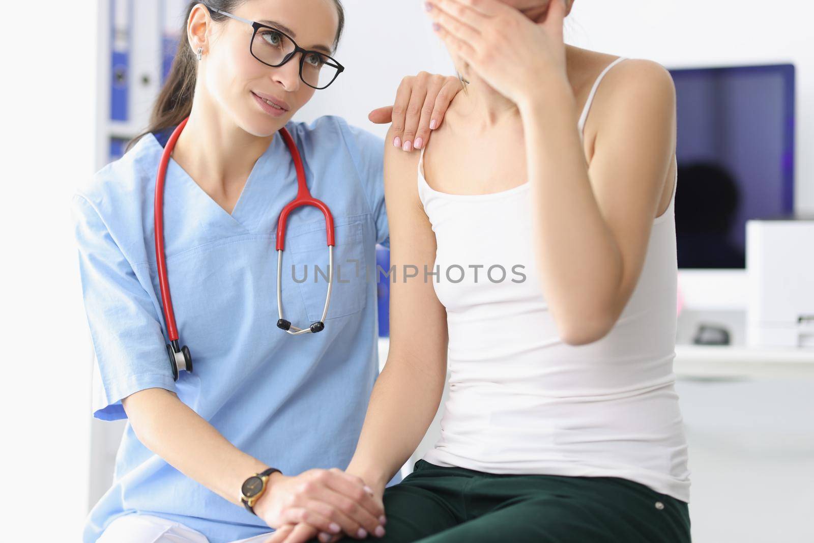 Medical worker comfort patient and say support words to her by kuprevich