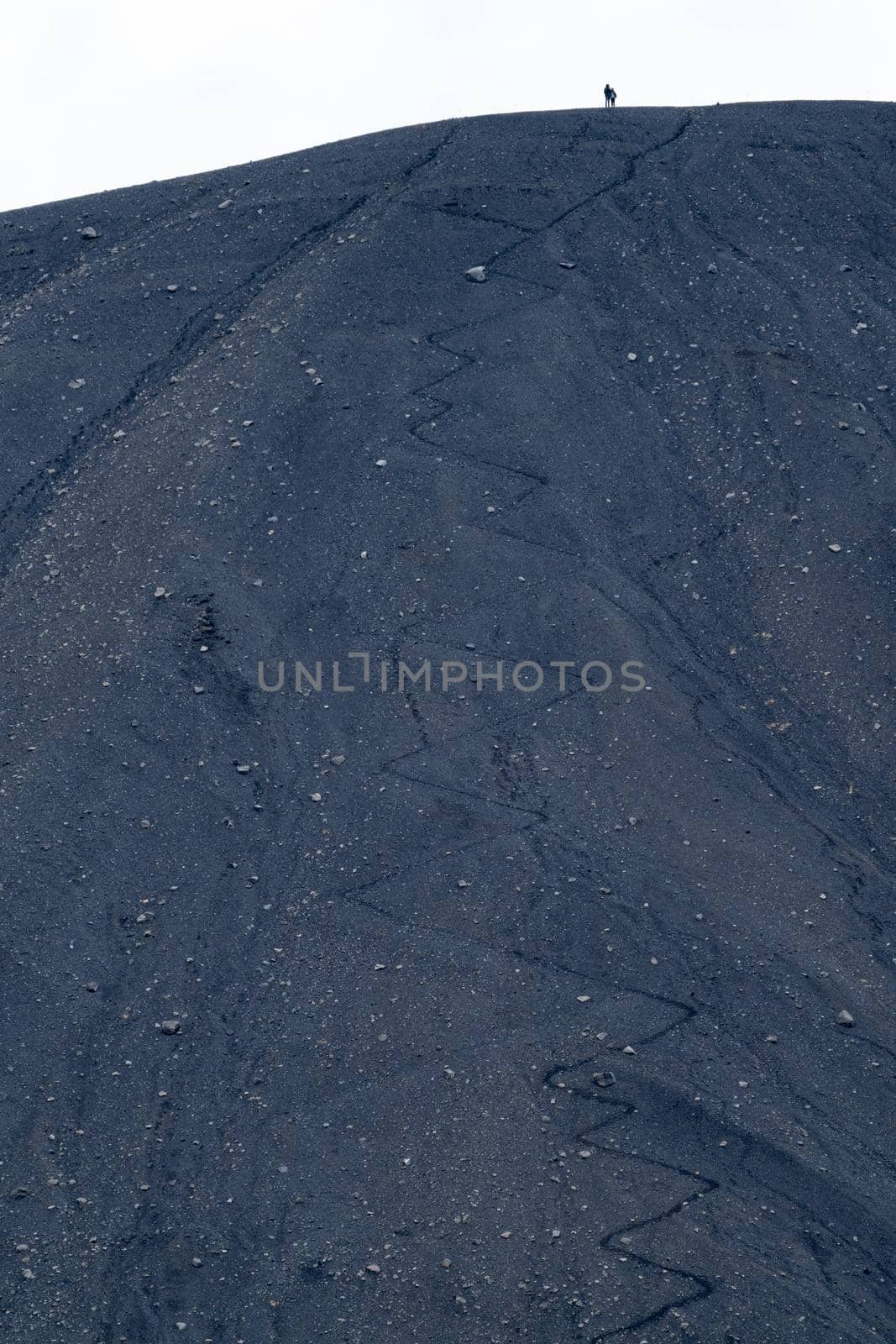 Couple on top of the volcano with hiking zigzag track by FerradalFCG