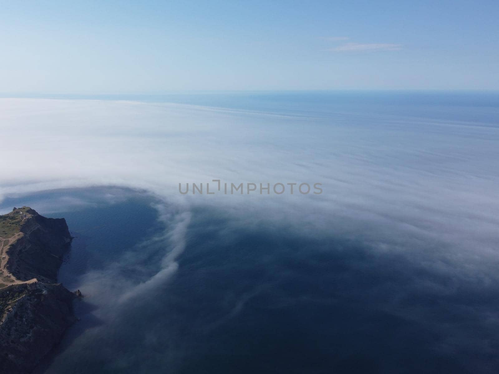 Abstract nature summer or spring ocean sea background. Small waves on water surface in motion blur with bokeh lights from sunrise.
