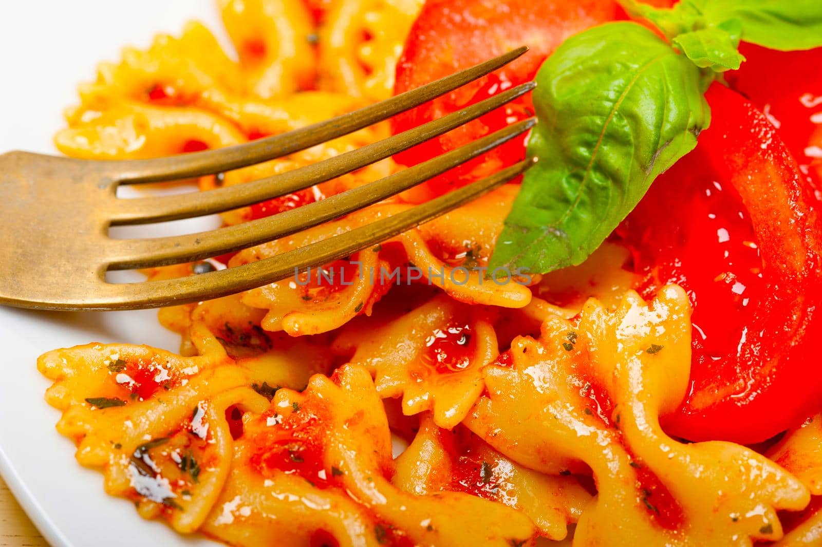 Italian pasta farfalle butterfly bow-tie and tomato sauce by keko64