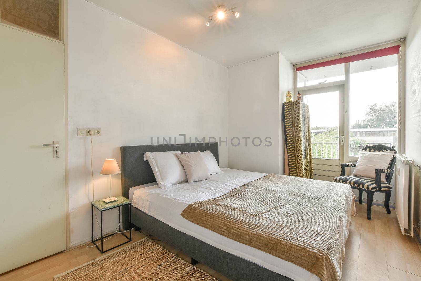 Large delightful bedroom with soft bed and parquet floor