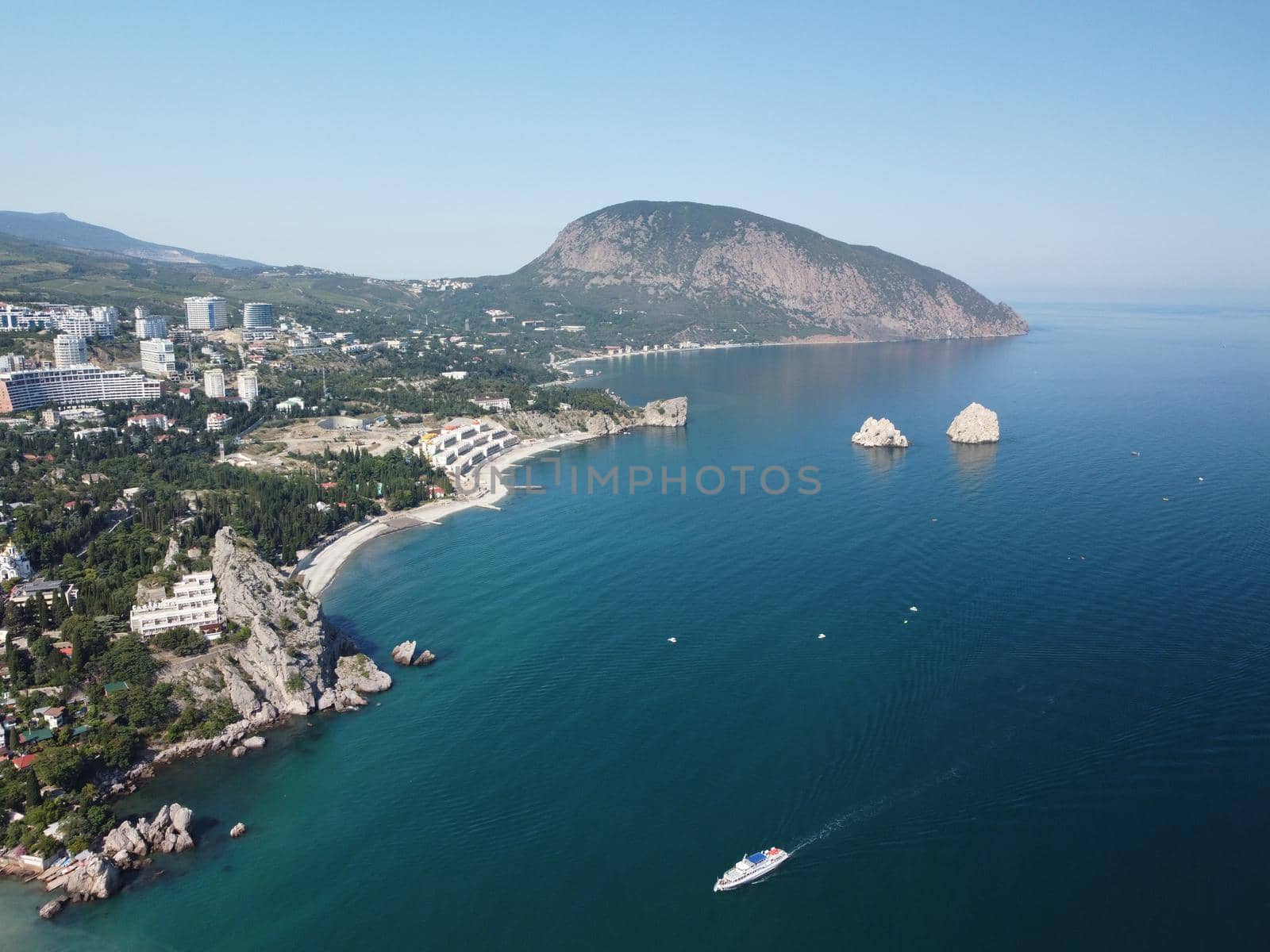 GURZUF, CRIMEA - Aerial View on the famous rocks Adalary, Two Twin-Cliffs with an edge of mountain Au-Dag in early spring morning at the South coast of Crimean Peninsula. Copy space