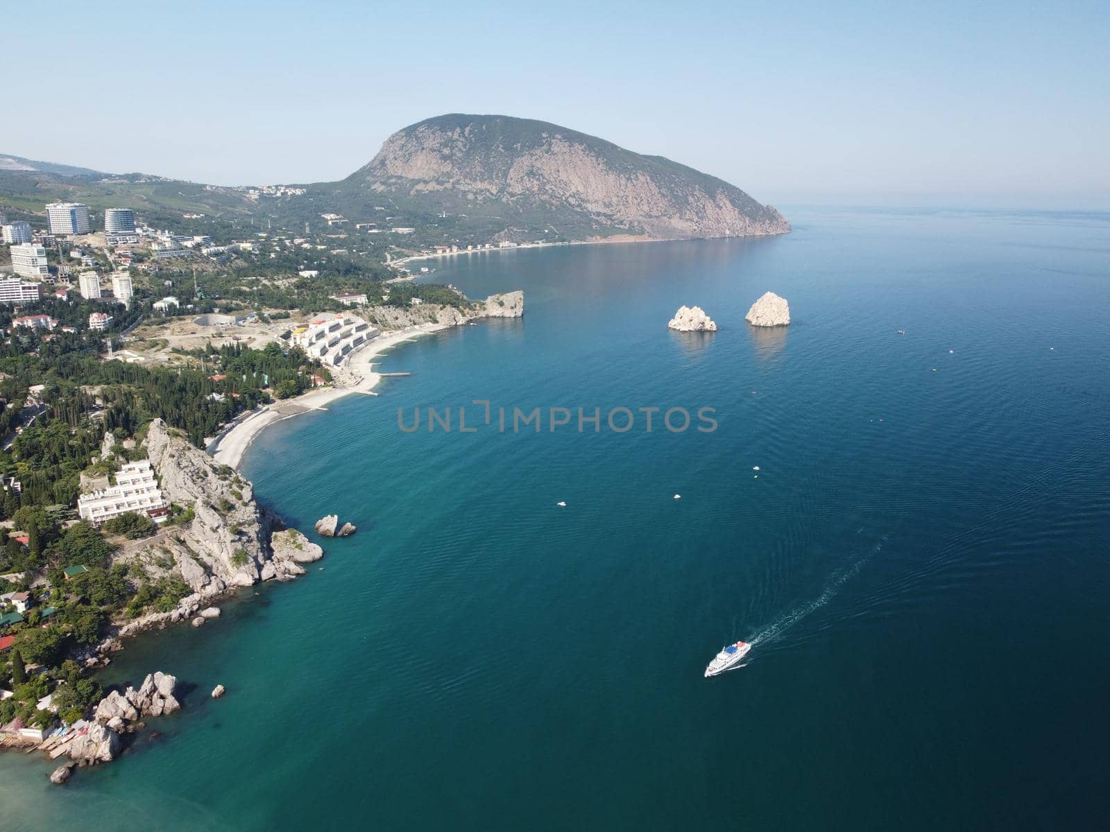 GURZUF, CRIMEA - Aerial View on the famous rocks Adalary, Two Twin-Cliffs with an edge of mountain Au-Dag in early spring morning at the South coast of Crimean Peninsula. Copy space