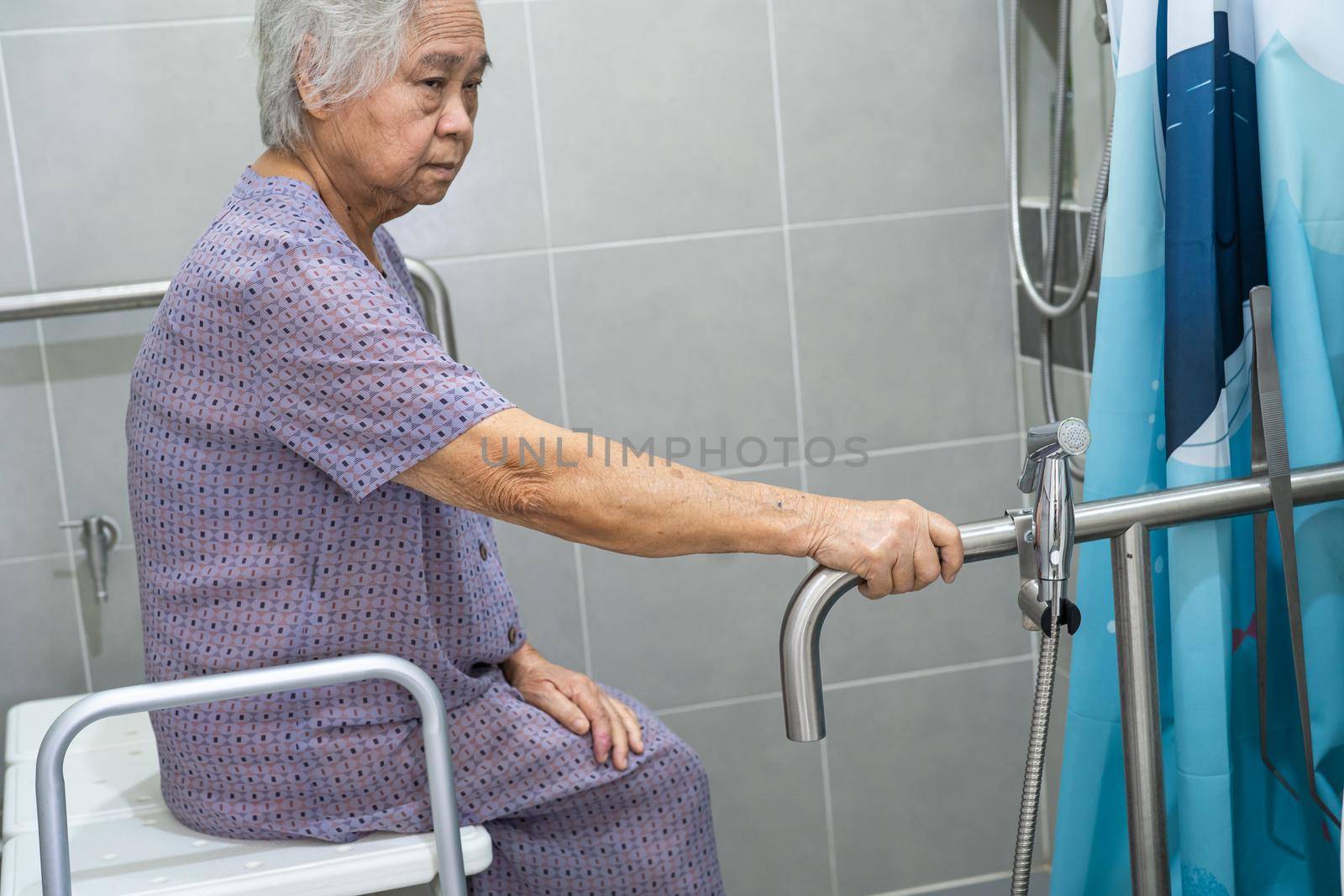 Asian senior or elderly old lady woman patient use toilet bathroom handle security in nursing hospital ward, healthy strong medical concept.