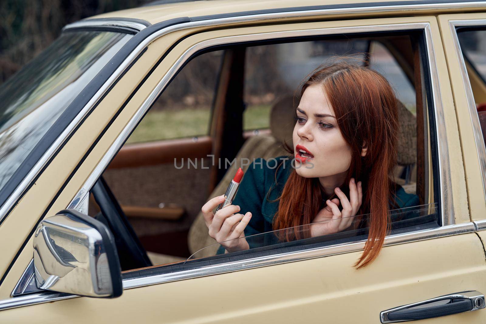 woman peeking out of car trip lifestyle fashion. High quality photo
