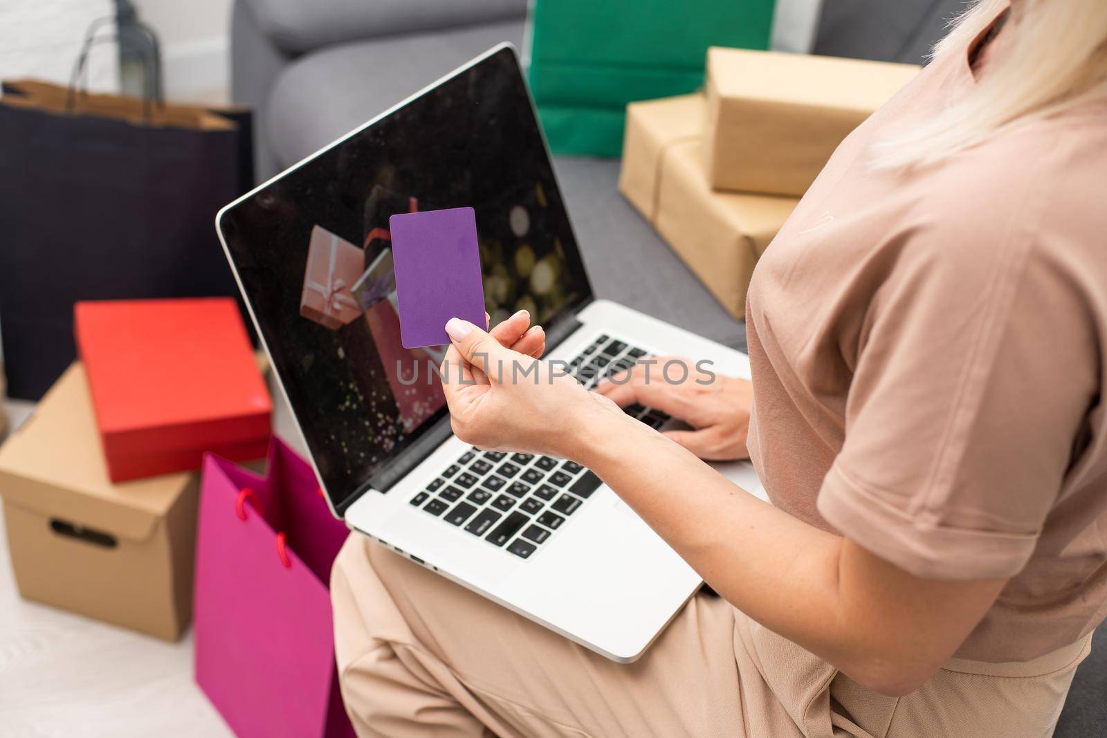 Happy woman doing online shopping at home, black friday.