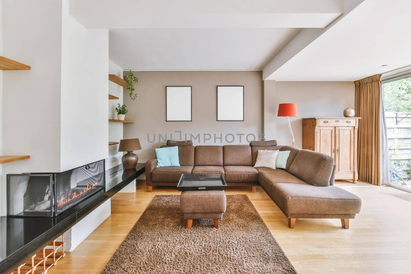 A chic and irresistible living room with a brown large low leather sofa