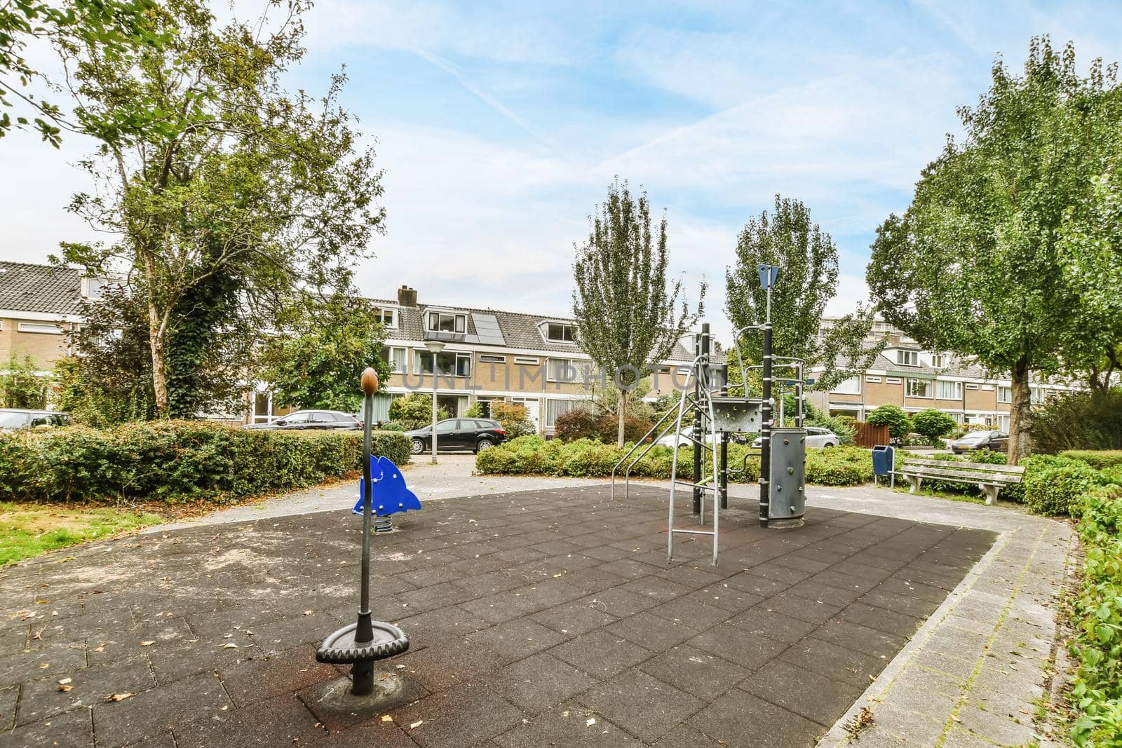 View of a beautiful playground with houses in the background