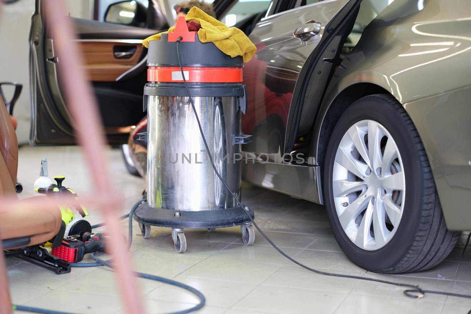 Modern equipment for car detailing, garage close-up by kuprevich