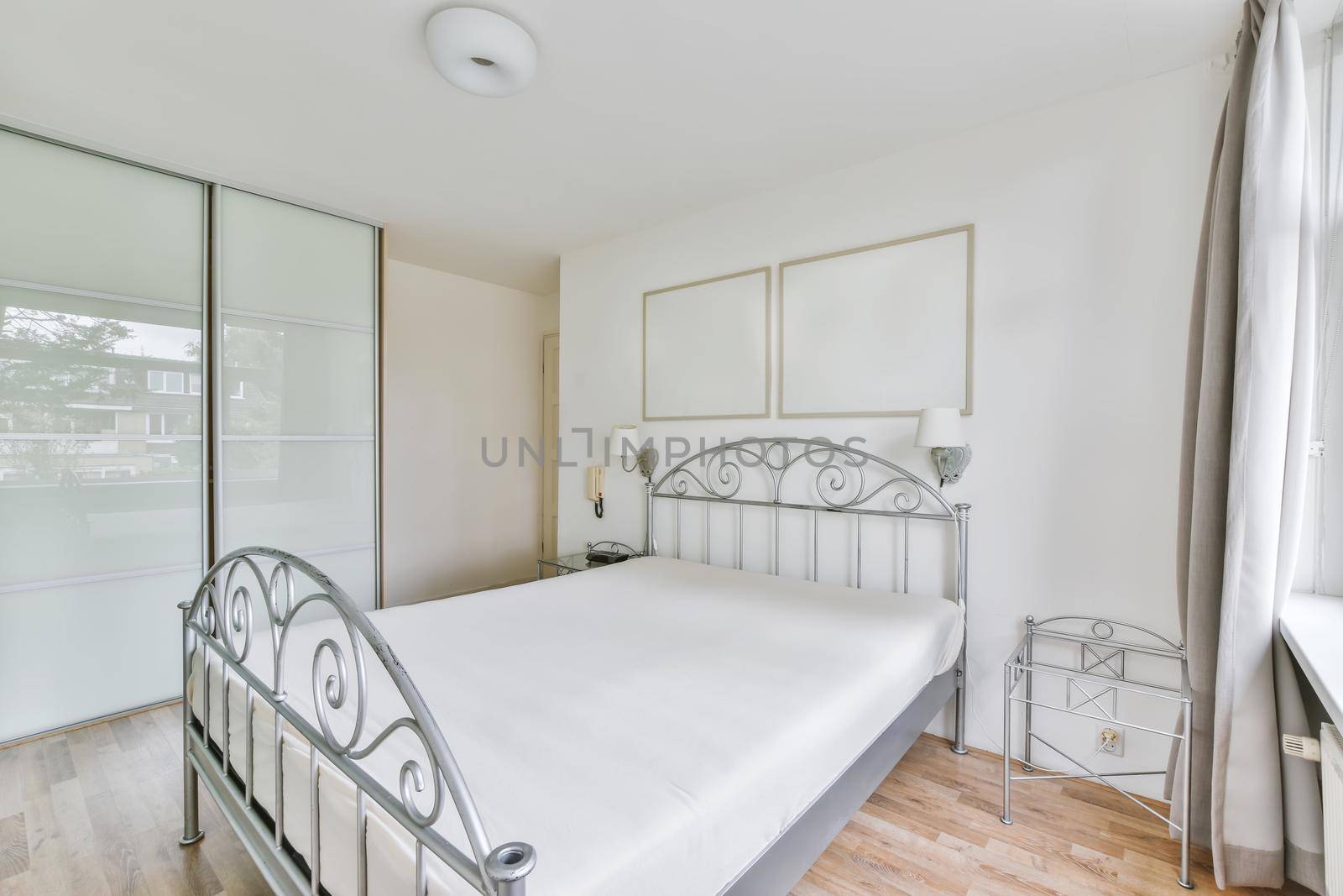 Cozy and elegant bedroom with full wall wardrobe