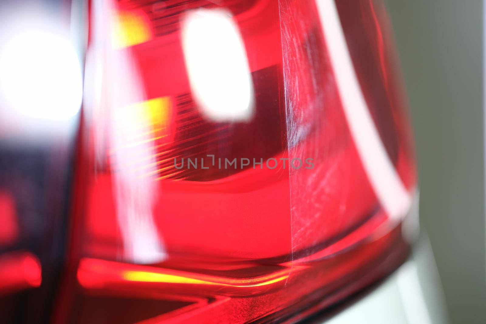 Bright red headlight of a car, close up. Headlamp by kuprevich