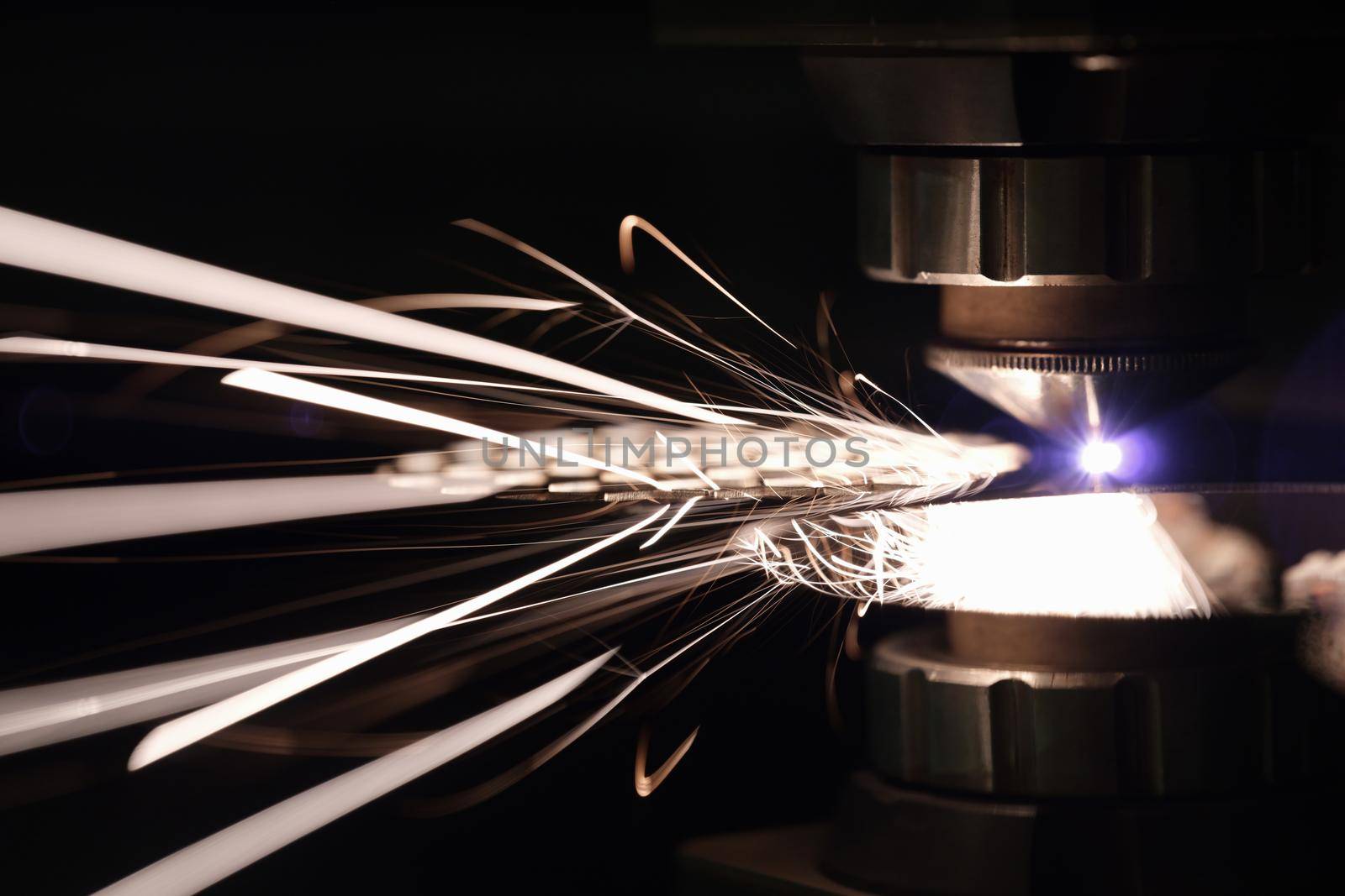 Stream of sparks from cutting metal, flash by kuprevich