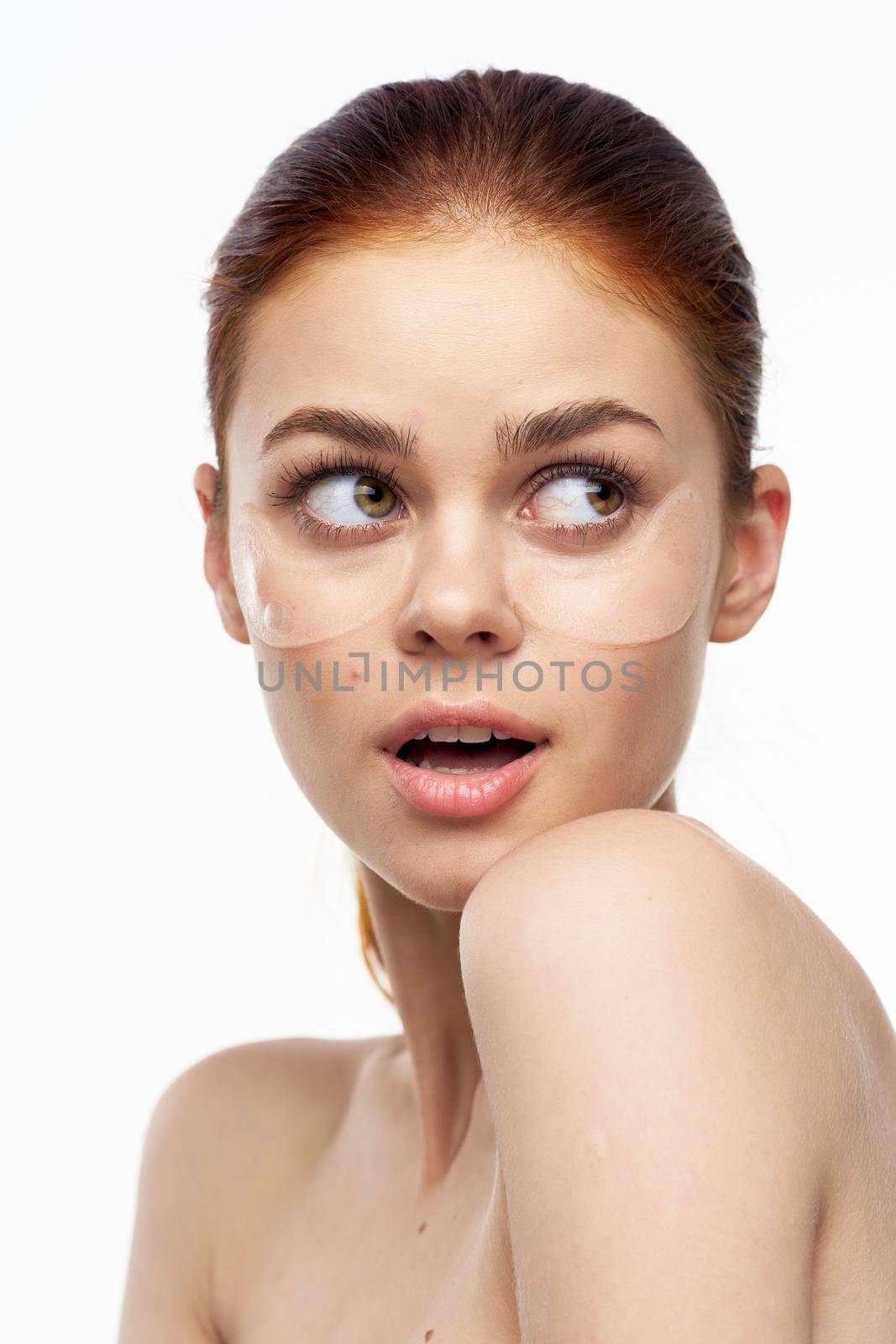 cheerful woman bare shoulders clear skin face mask. High quality photo