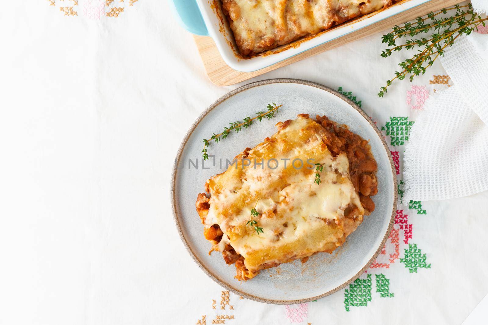 Cannelloni pasta with filling of ground beef, tomatoes, baked with bechamel by NataBene