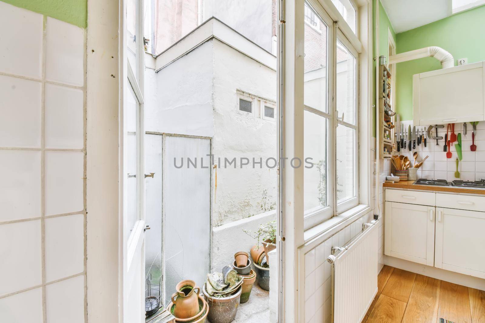 Open door near the kitchen leading to the courtyard