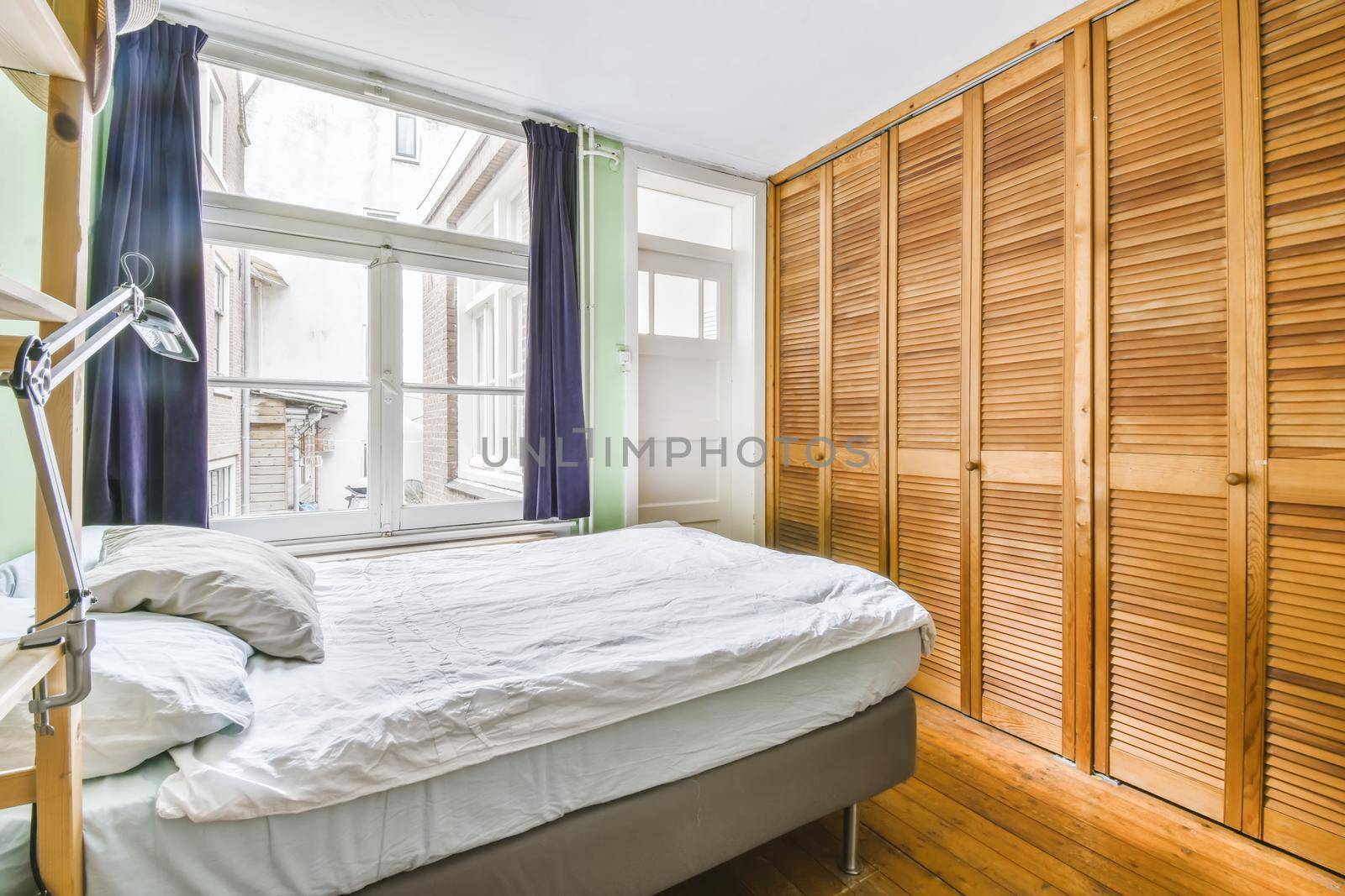Small bedroom with a large comfortable soft bed