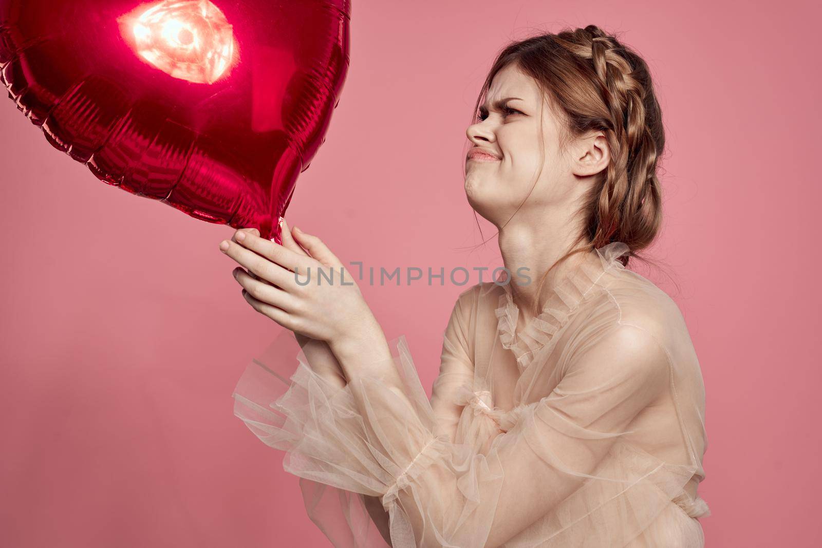 portrait of a woman in a dress balloon Valentine's Day isolated background. High quality photo
