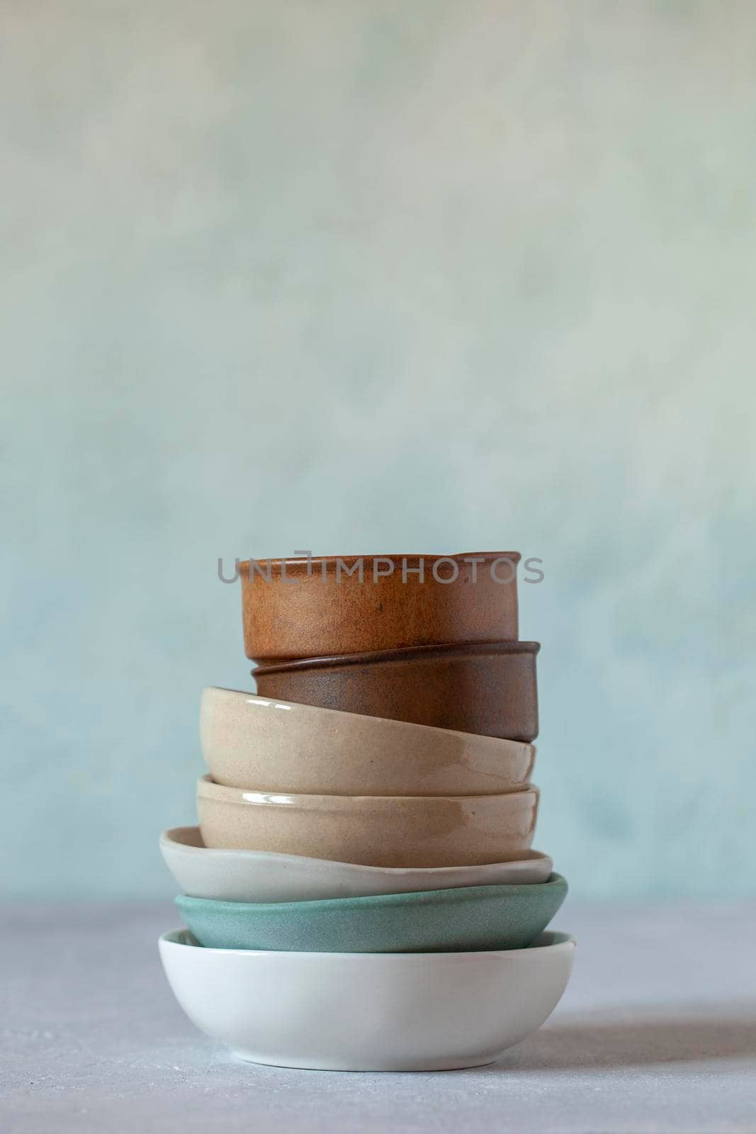 small bowls on the light green background, rustic style, selective focus