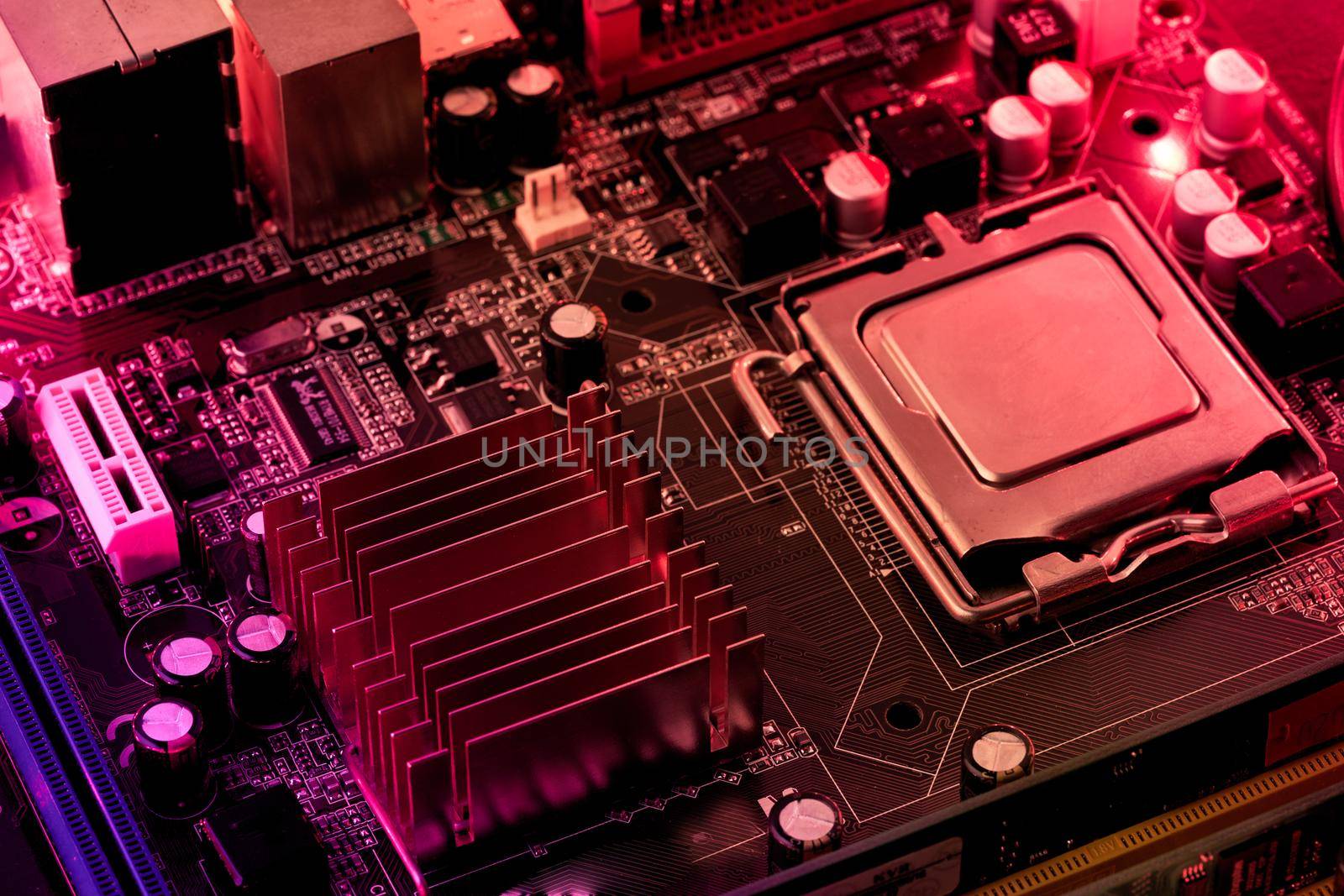 Computer motherboard background with blur neon multicolor glow, pc backdrop, close up by NataBene