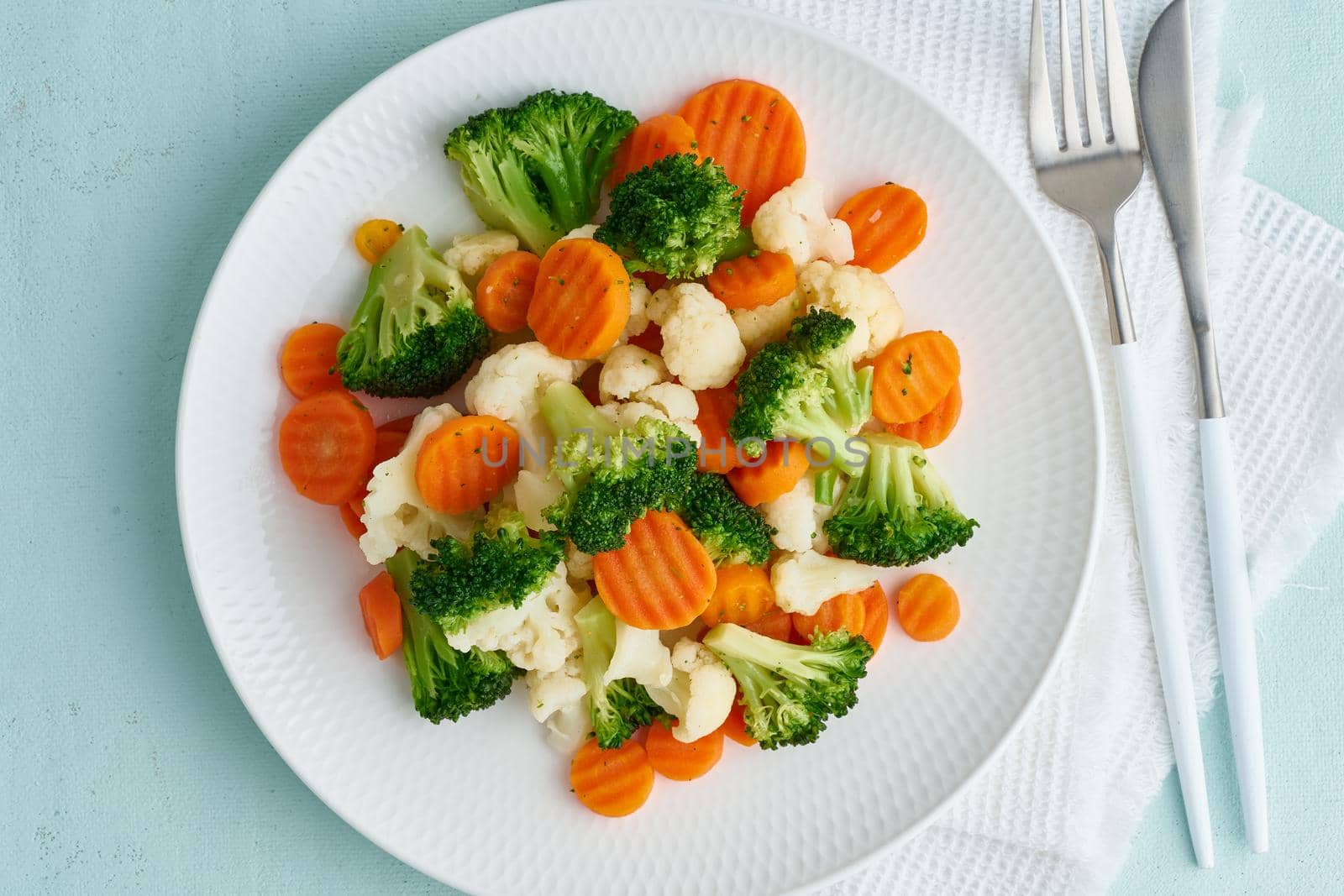 Mix of boiled vegetables. Broccoli, carrots, cauliflower. Steamed vegetables for dietary low-calorie diet. FODMAP, dash diet, vegan, vegetarian, top view