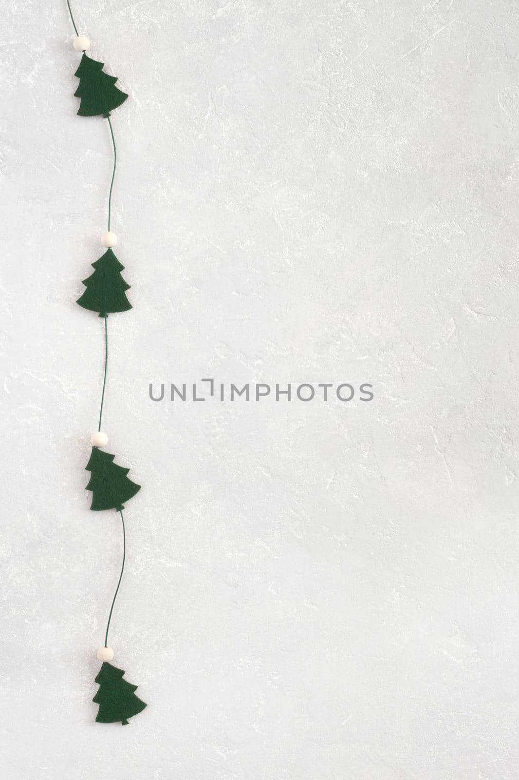New Year and Christmas trees garland on grey background, copy space