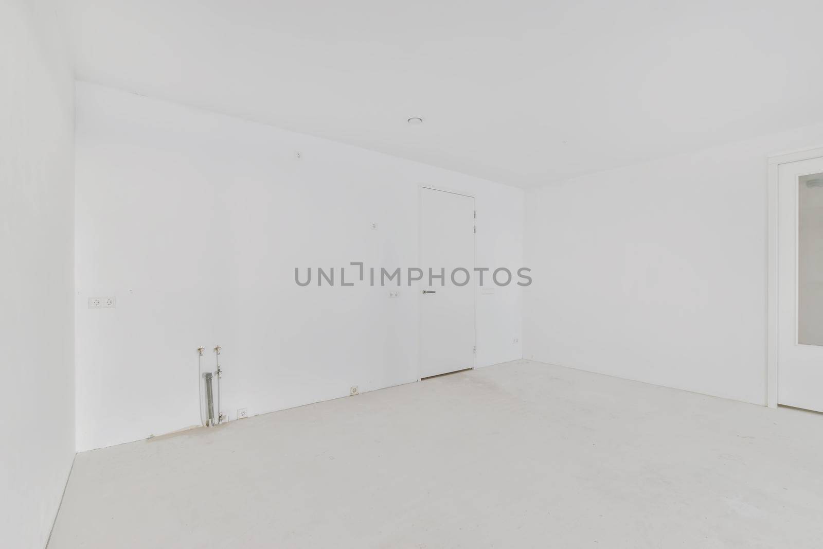 Modern room with wooden floor and white walls