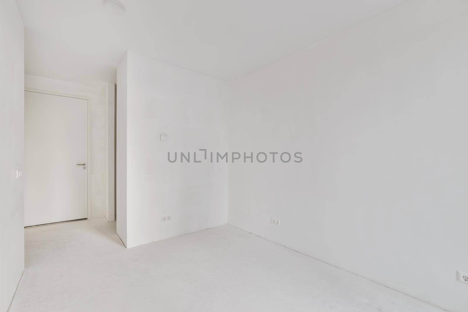 Modern room with wooden floor and white walls