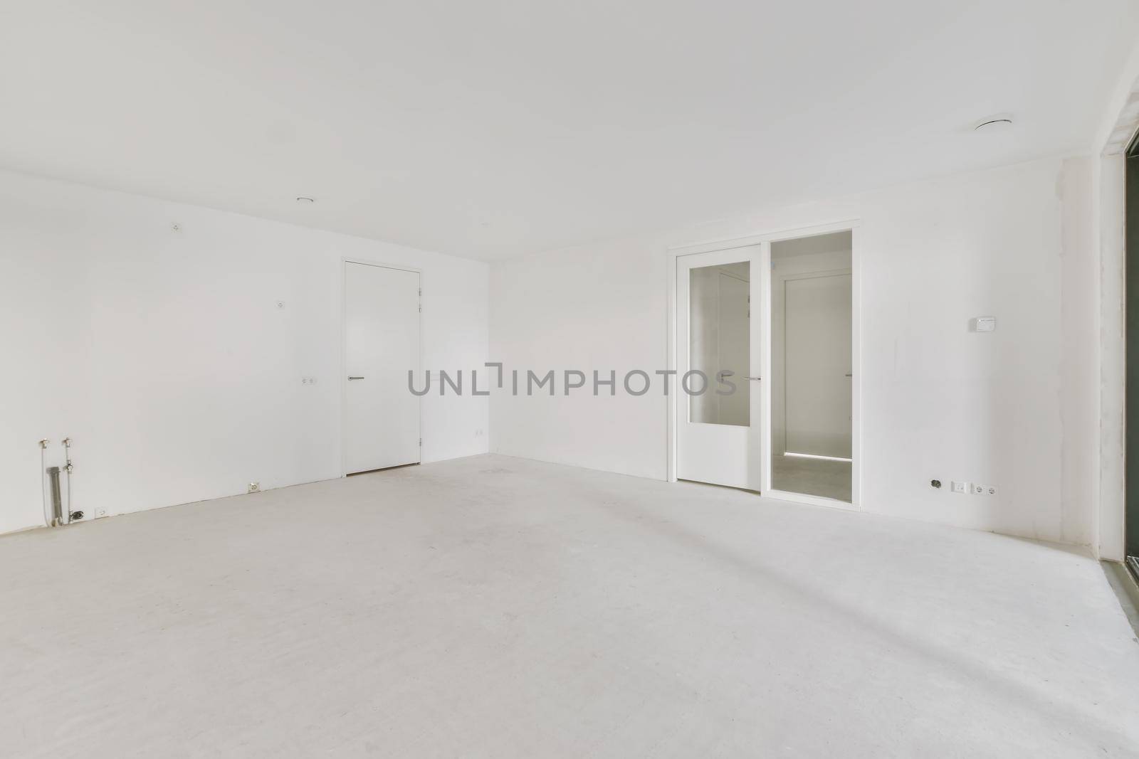 Modern room with wooden floor and white walls
