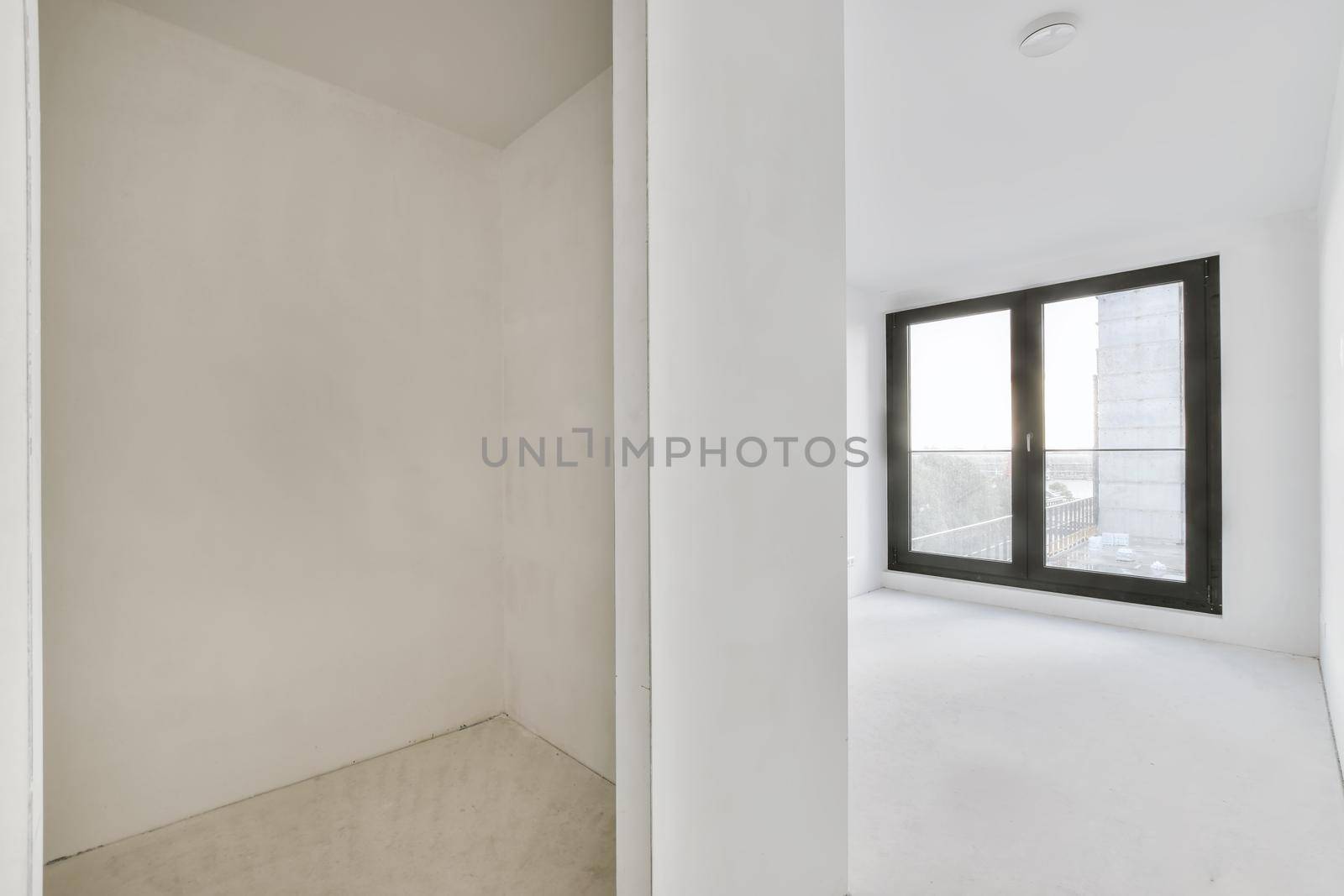 Modern room with wooden floor and white walls