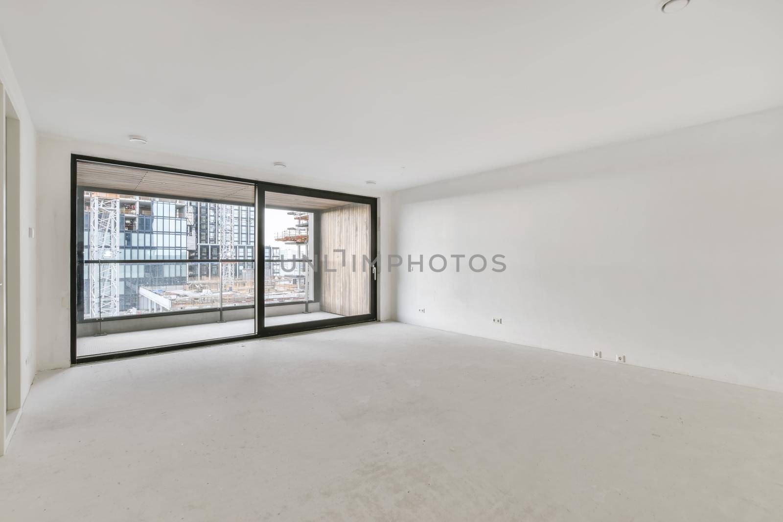 Modern room with wooden floor and white walls